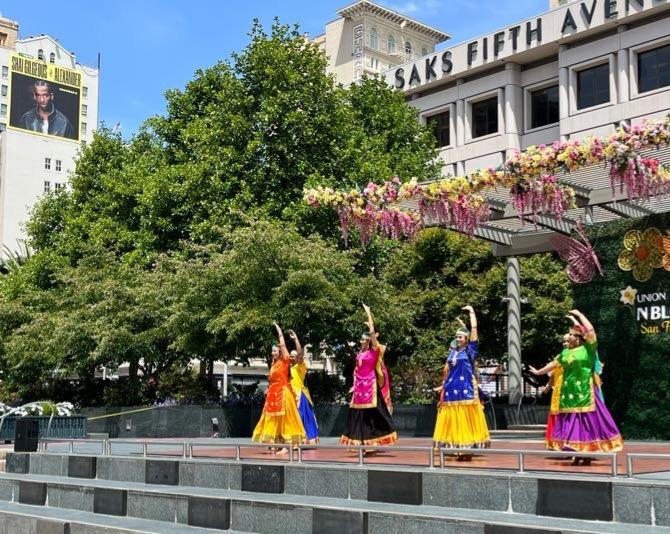 Performers on stage in Union Square for a free programming series. 