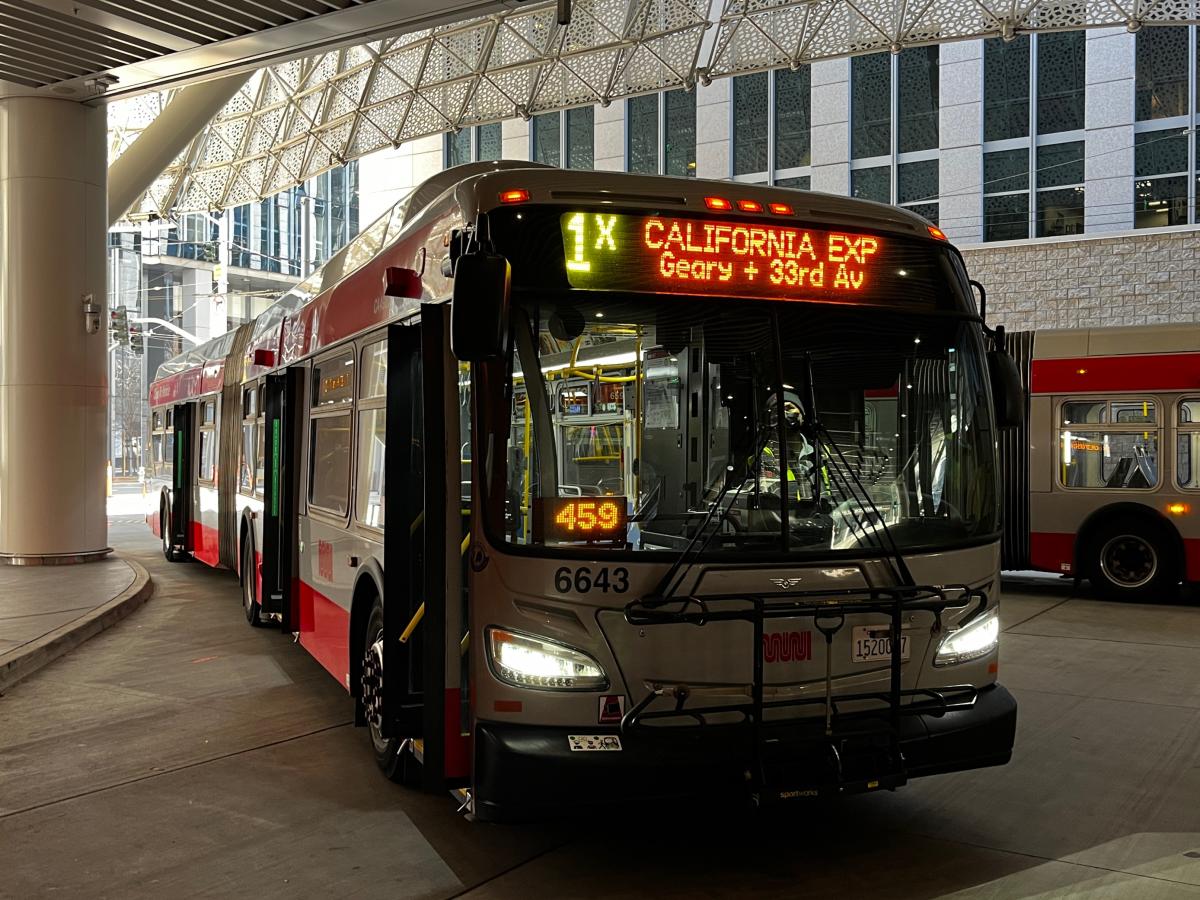A bus at a bus depot.