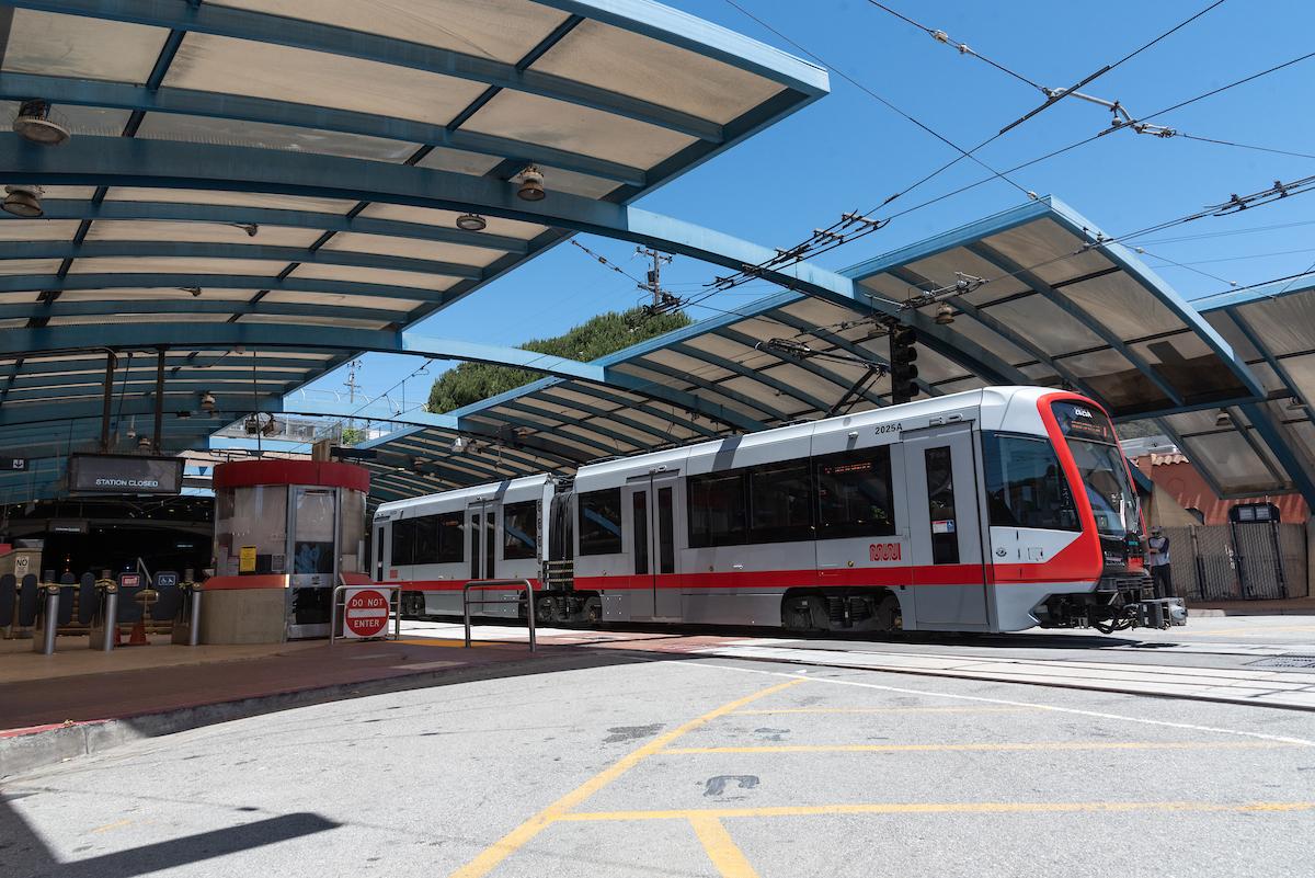 Photo of a Muni Metro train entering West Portal Station.