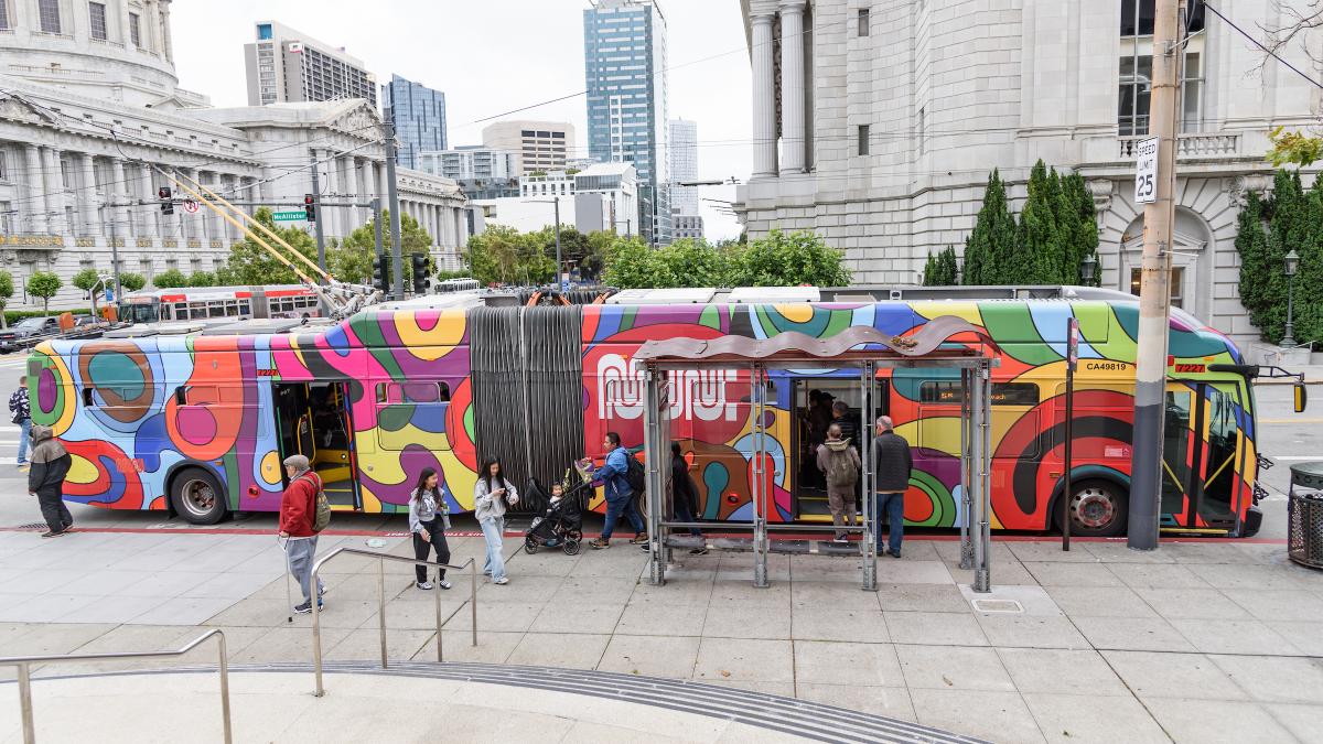 People board the Psychedellibus near San Francisco City Hall.