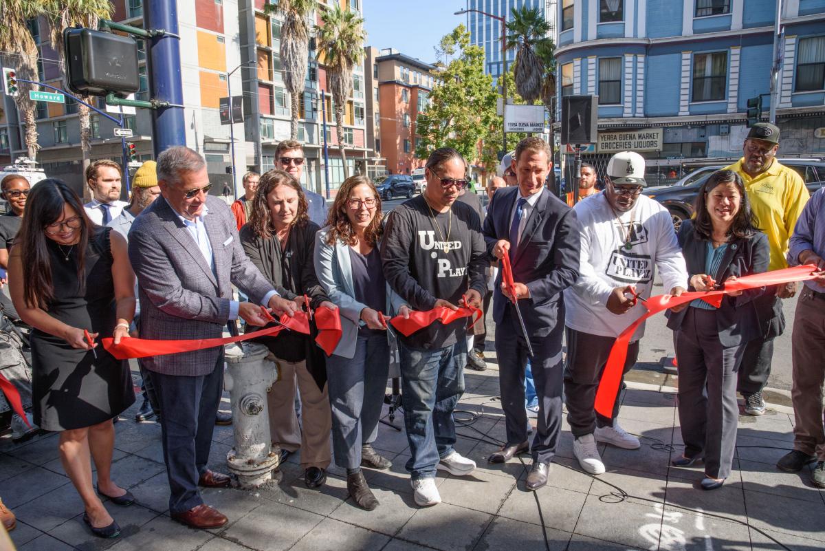 Group photo during the 6th Street Pedestrian Safety Project ribbon-cutting. Features Mayor Daniel Lurie, SFMTA Director of Transportation Julie Kirschbaum, Supervisor Matt Dorsey and others.