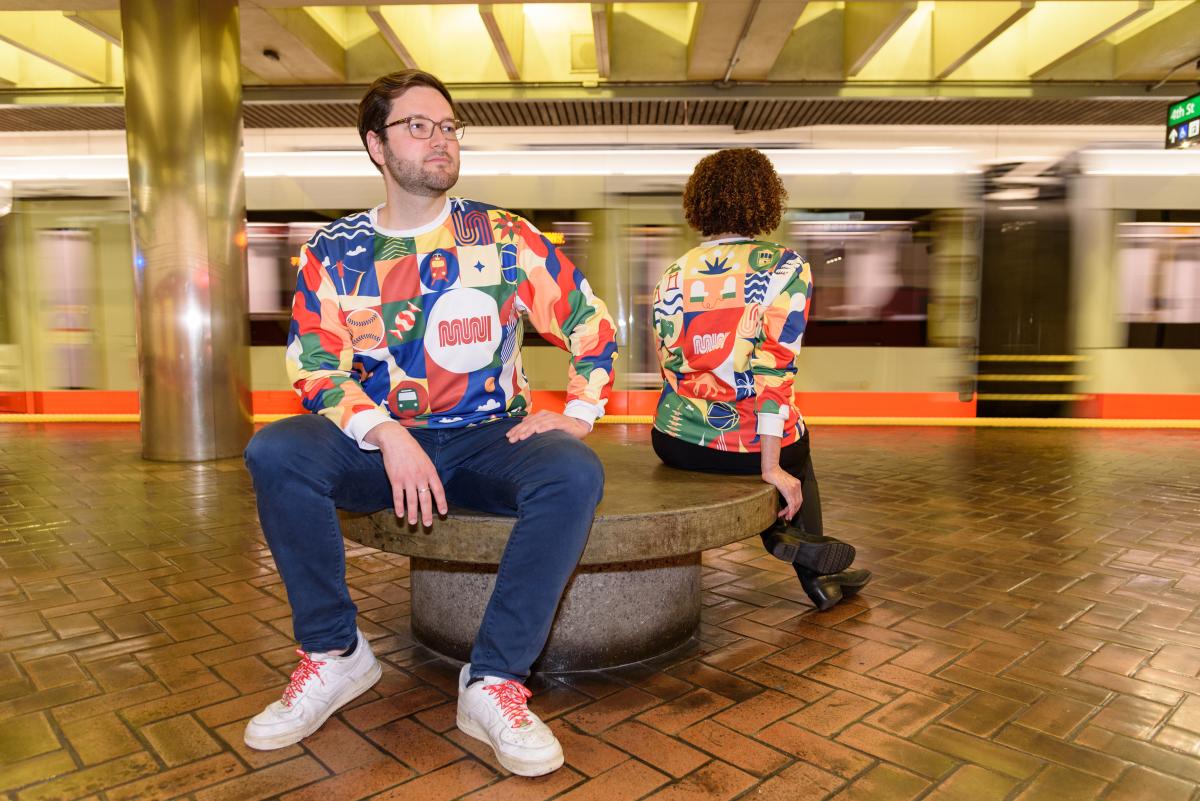 Artist Anton Belov wearing Muni's holiday pullover.