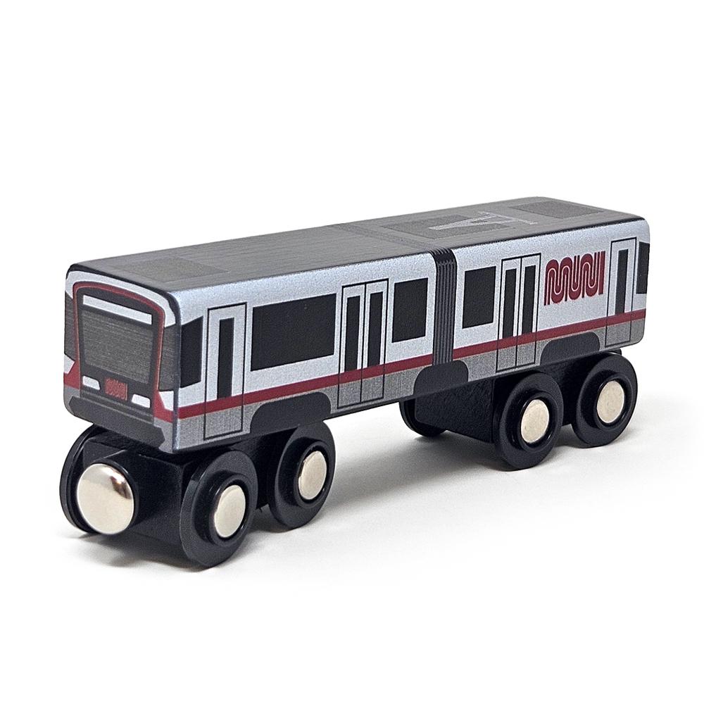 Close-up of the new Muni Metro Wooden Toy -- a gray and red train with large black wheels.