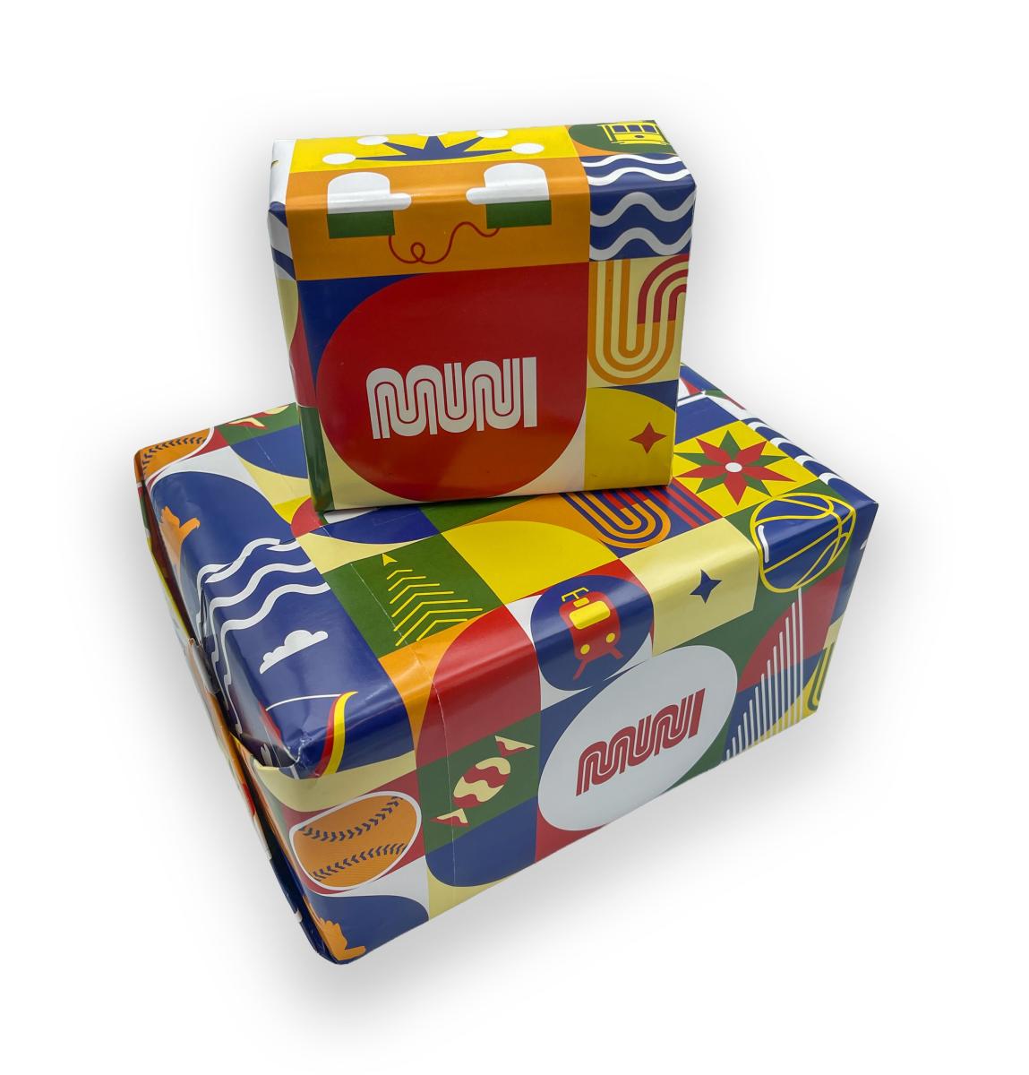 Patchwork of the City Holiday Wrapping Paper wrapped around a large box and a small one.