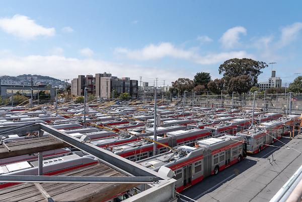 Overhead view of Potrero Yard, with many trolley buses parked near each other.