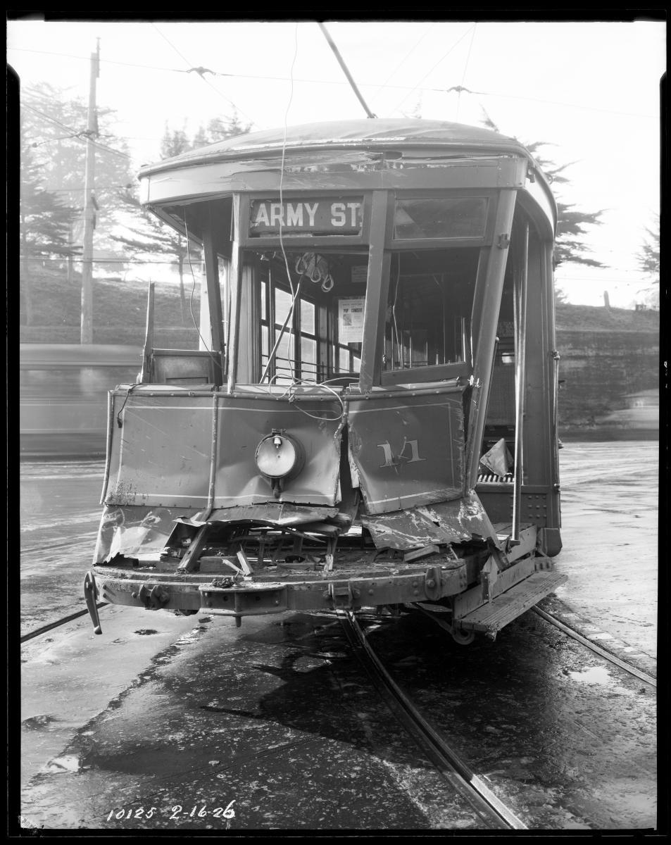 Black and white photo of a damaged streetcar from 1926.