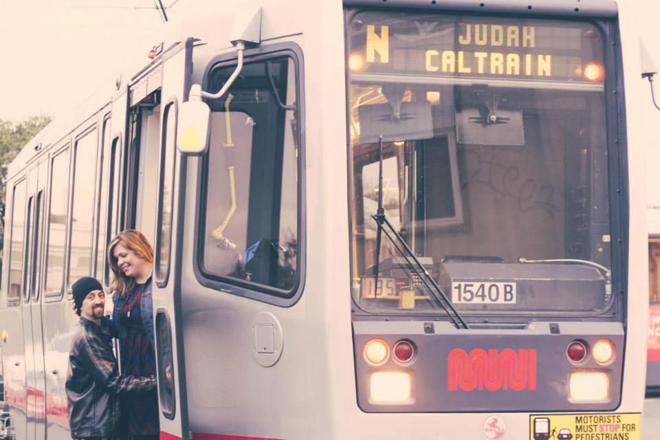 Two people on an N Judah train.