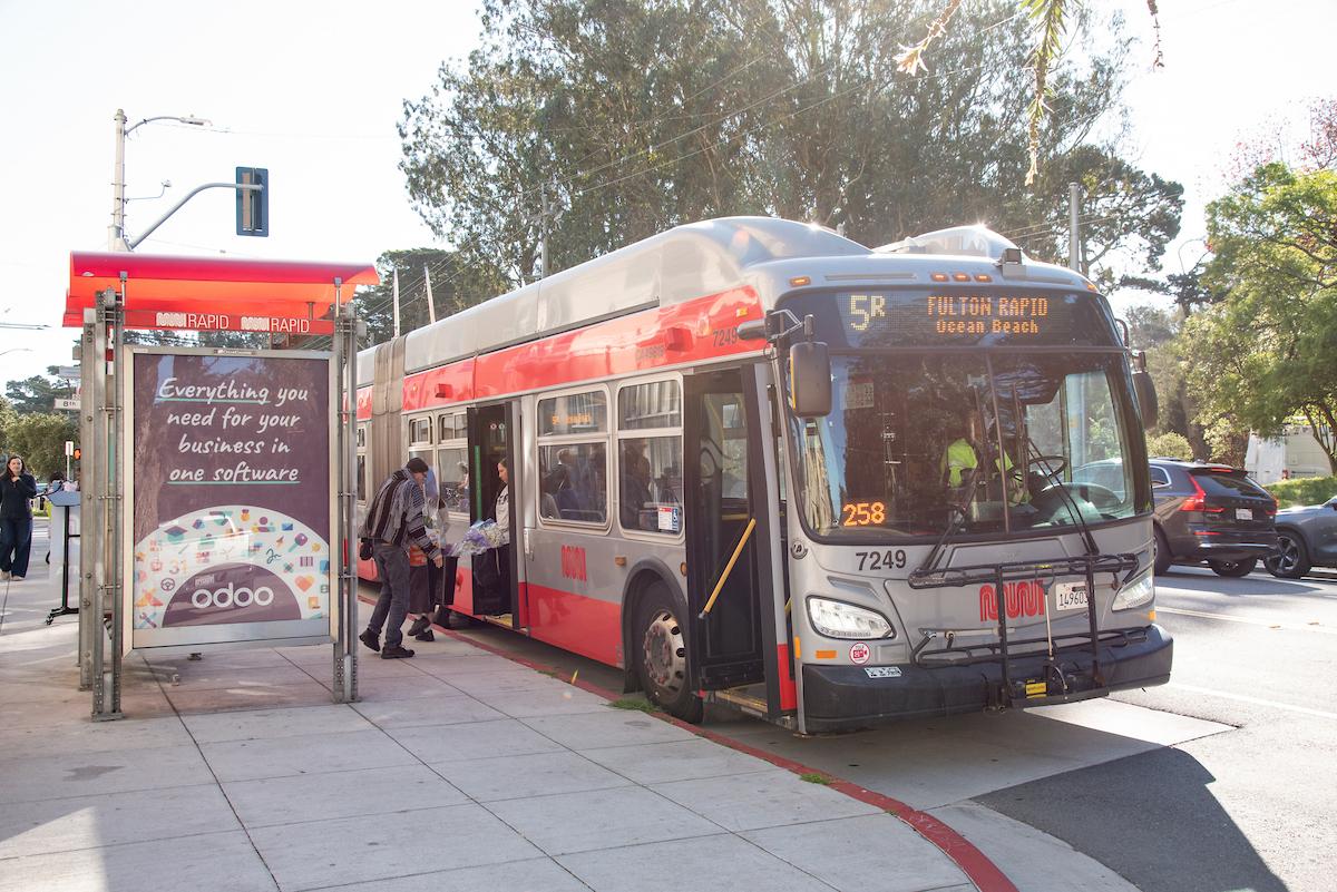 5R bus stopping to pick up passengers at a new bus bulb designed to improve safety for riders.