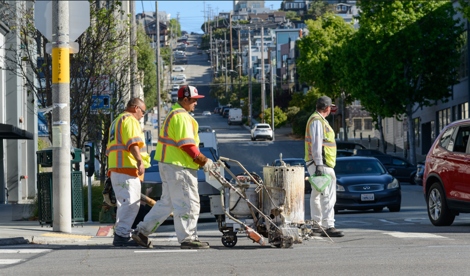 SFMTA Employees paint cross walks