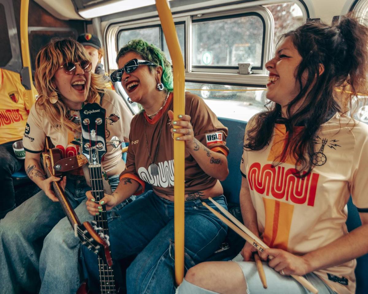 Riders in SF City Football Club’s Muni "worm" logo jerseys.