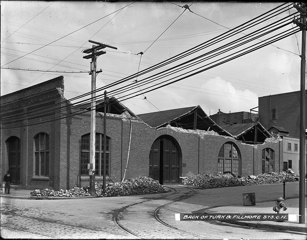 Power lines near a damaged building