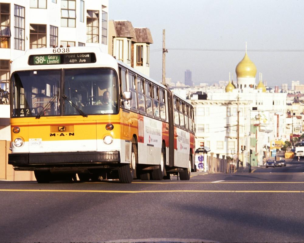 A first-generation articulated Muni bus runs on the 38L route in 1992.