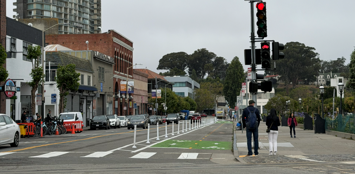 new bicycle lane and bicycle signal on Beach Street at Hyde Street looking west