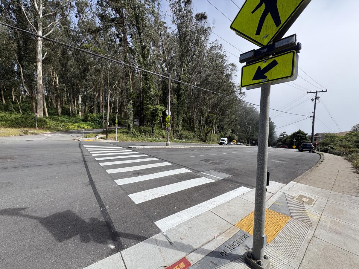 White permanent crosswalk painted at the newly installed RRFB at Dellbrook Avenue and Clarendon Avenue 