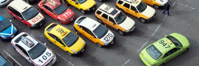Taxi cabs parked waiting for passengers