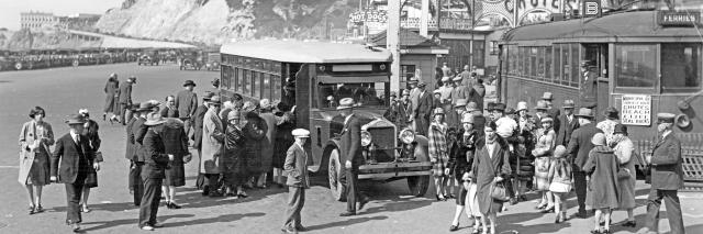 Muni B Geary streetcar and Muni bus with crowd in front of amusement park at Ocean Beach in 1927