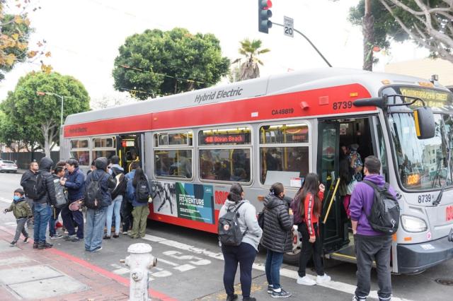 Riders board the 48 Quintara-24th Street, one of Muni’s Equity Strategy routes.