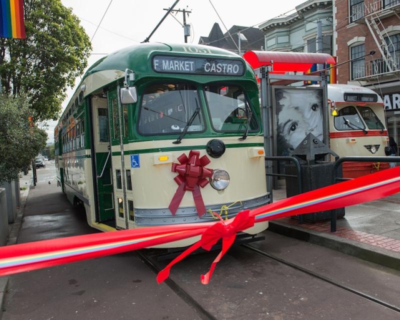 Creme and Green Livery Street with a red bow on the front behind a red ribbon.