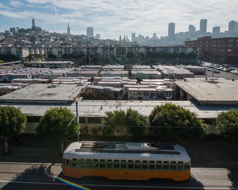 View overlooking Muni's Kirkland bus yard in Fisherman's Wharf, with a historic streetcar on Beach Street in front.