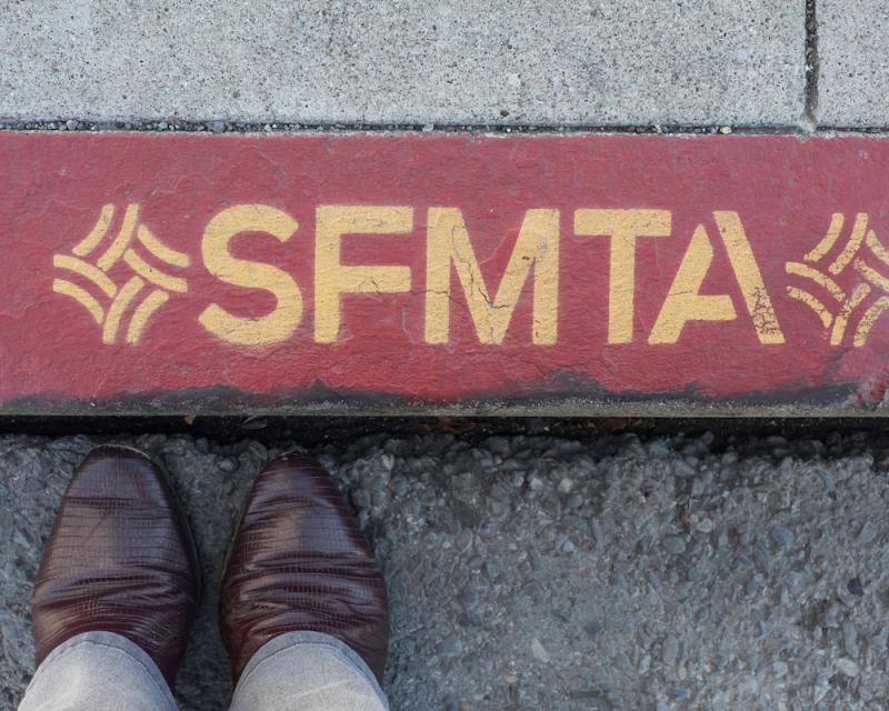 Red color curb with SFMTA writing