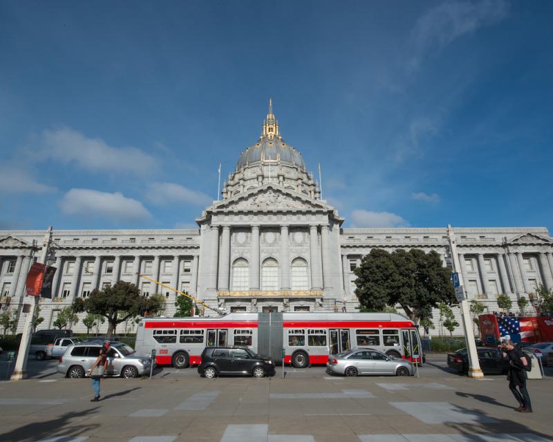 Muni bus in front of SF City Hall on Van Ness Avenue