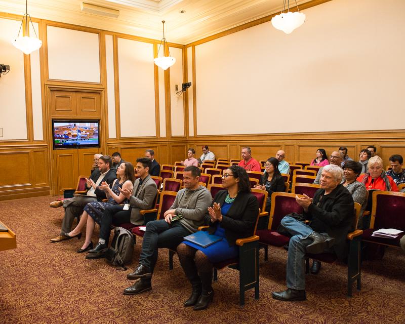 group of people seated in board room audience