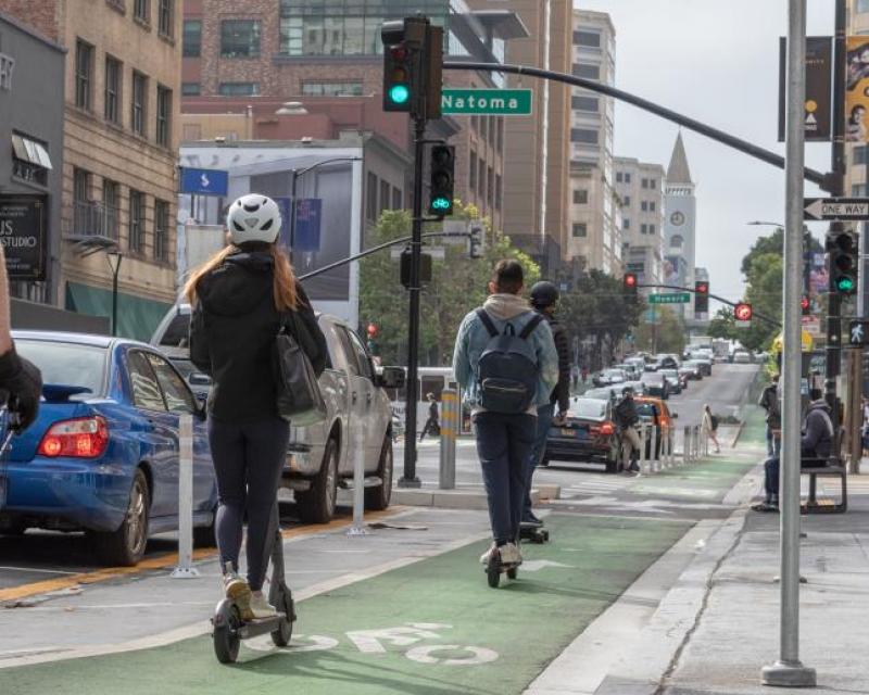 Scooter riders on bike lane