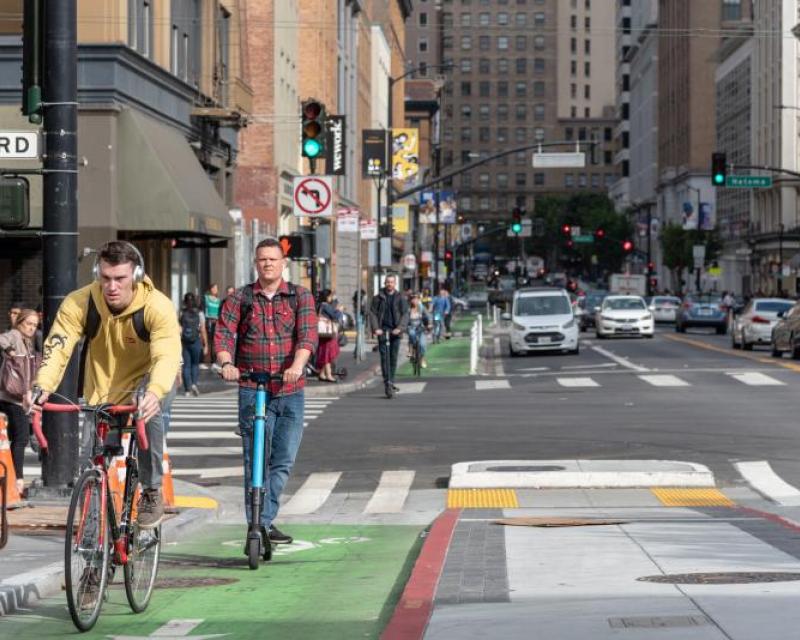 Scooter and bike riding in San Francisco downtown