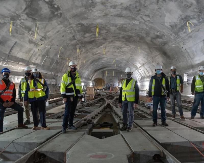 Staff giving a Central Subway tour