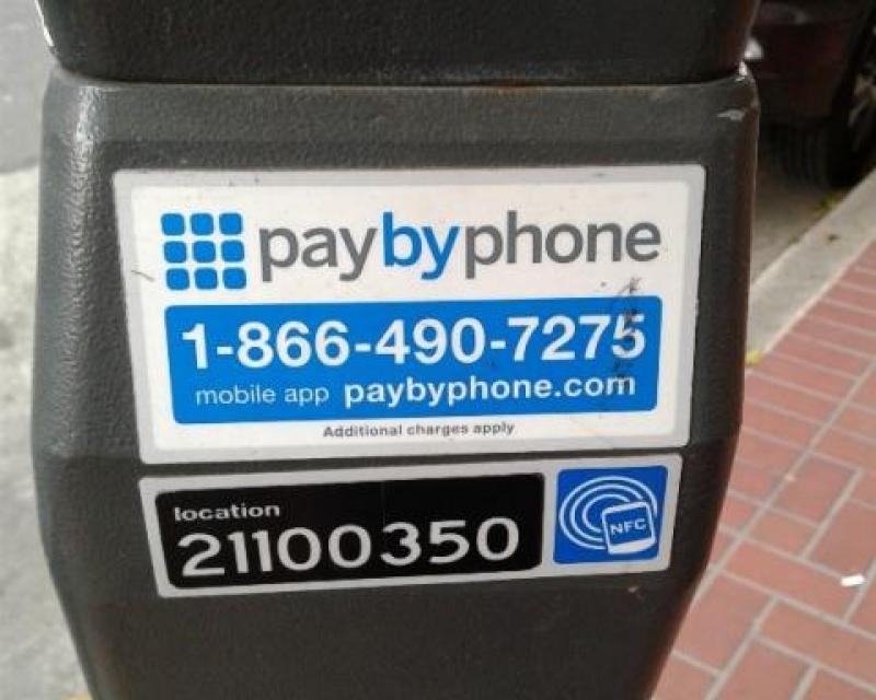 Pay by phone decal showing phone number, meter number, and URL