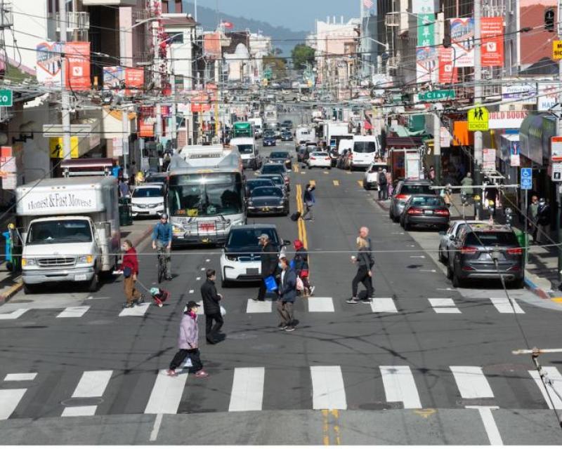 At an intersection, vehicle traffic stops in all directions so pedestrians can cross through from all corners