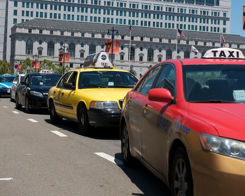 line of taxicabs outside city hall in civic center plaza