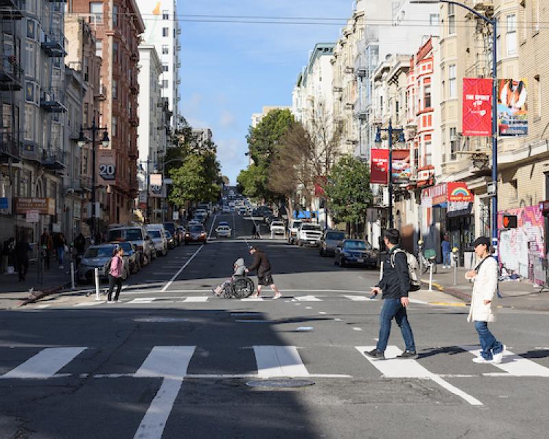 Image of people crossing the street downtown