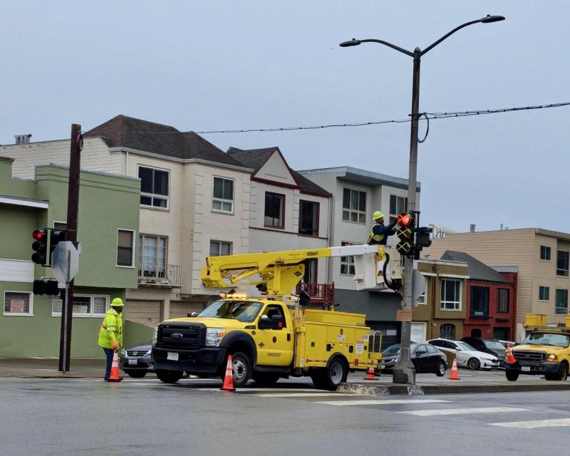 SFMTA Signal Shop crews activate a traffic signal at 41st Avenue and Lincoln Way.