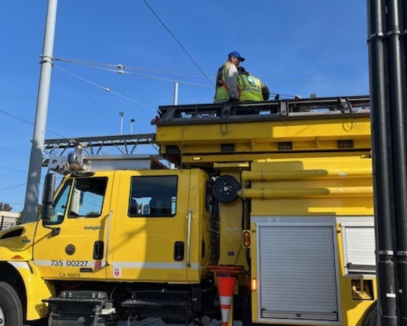 the SFMTA team working together at MME to install overhead lines