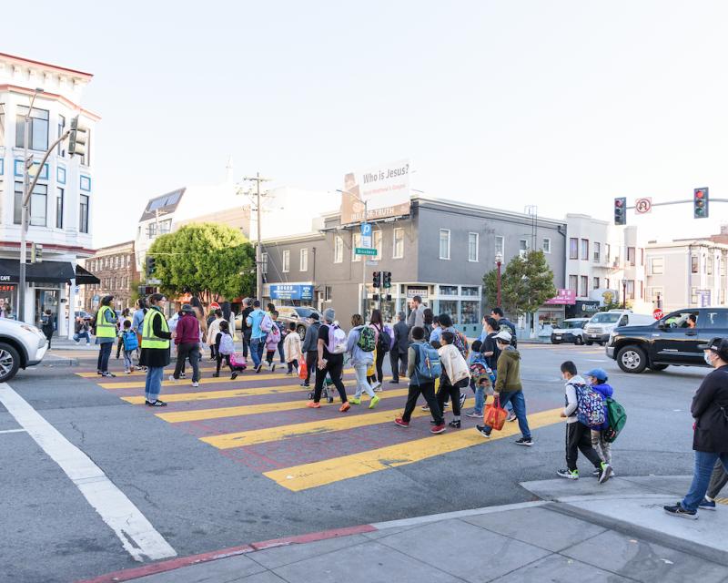 Students cross Broadway towards Jean Parker Elementary. 