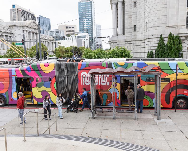 People board the Psychedellibus near San Francisco City Hall. 