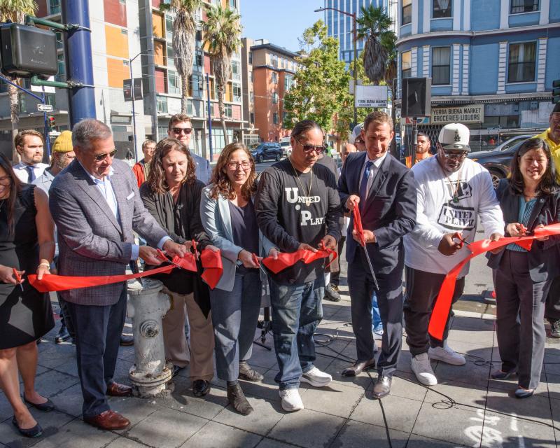 Group photo during the 6th Street Pedestrian Safety Project ribbon-cutting. Features Mayor Daniel Lurie, SFMTA Director of Transportation Julie Kirschbaum, Supervisor Matt Dorsey and others.