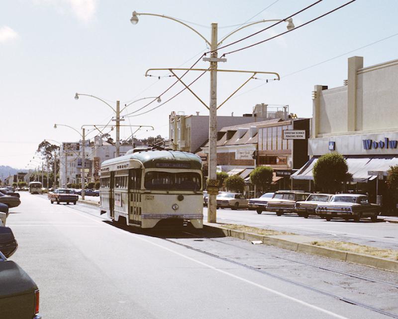 Vintage color photo dated 1972 of a historic streetcar on the M line driving down West Portal.
