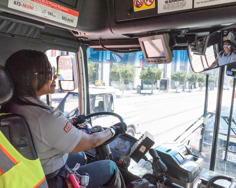 Operator driving a Muni bus. 