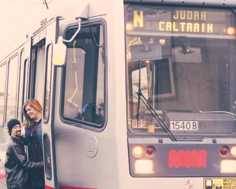 Two people on an N Judah train.