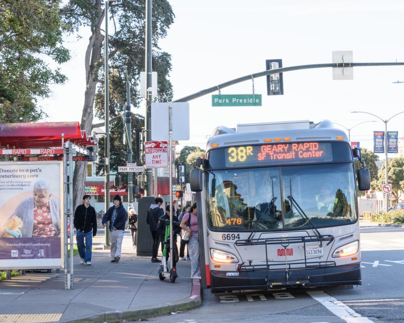 People board a 38R on Park Presidio and Geary. 