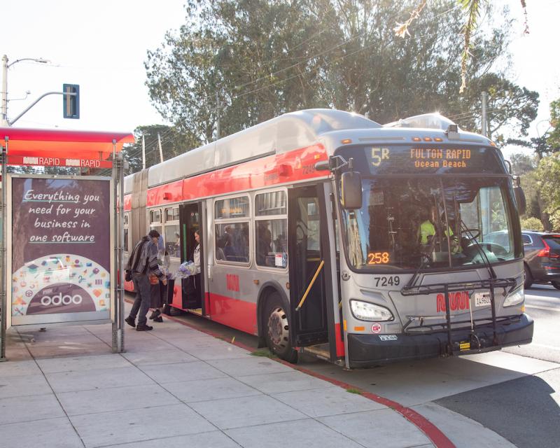 5R bus stopping to pick up passengers at a new bus bulb designed to improve safety for riders.
