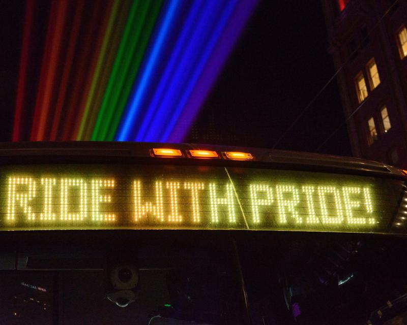 Digital letters on a bus that spell out “Ride with Pride.”