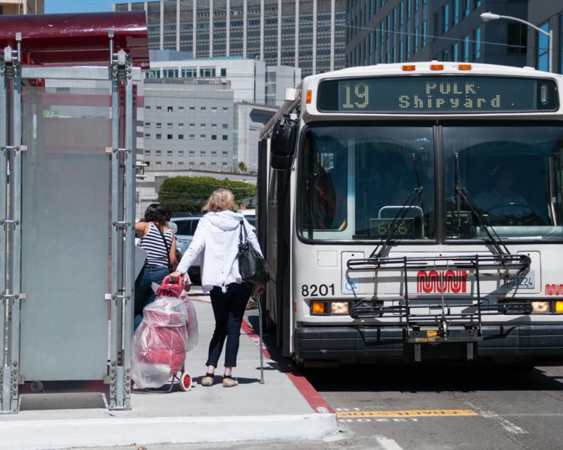 19 polk bus at stop on 8th street