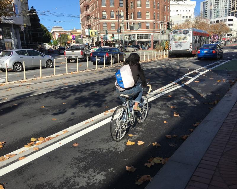 Cyclist using the newly installed raised bikeway