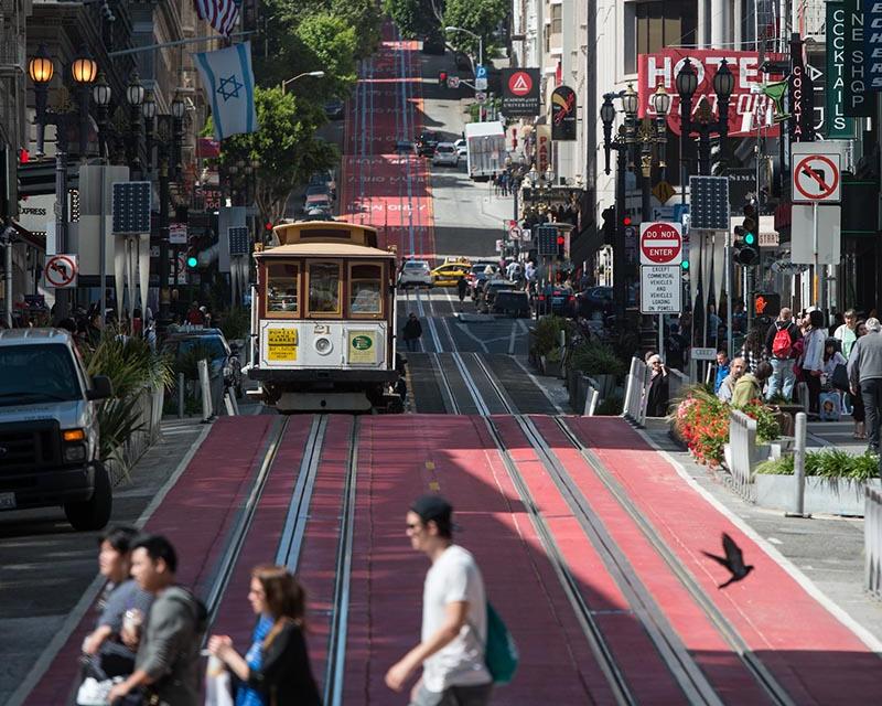 People crossing Powell Street, red lane pilot