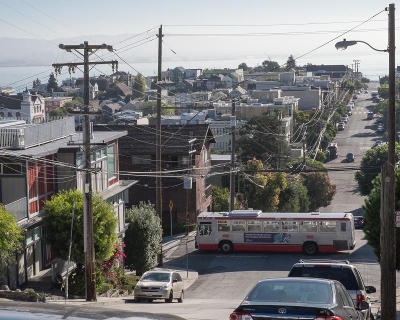 19 Polk bus driving through Potrero Hill with neighborhood and bay views in background