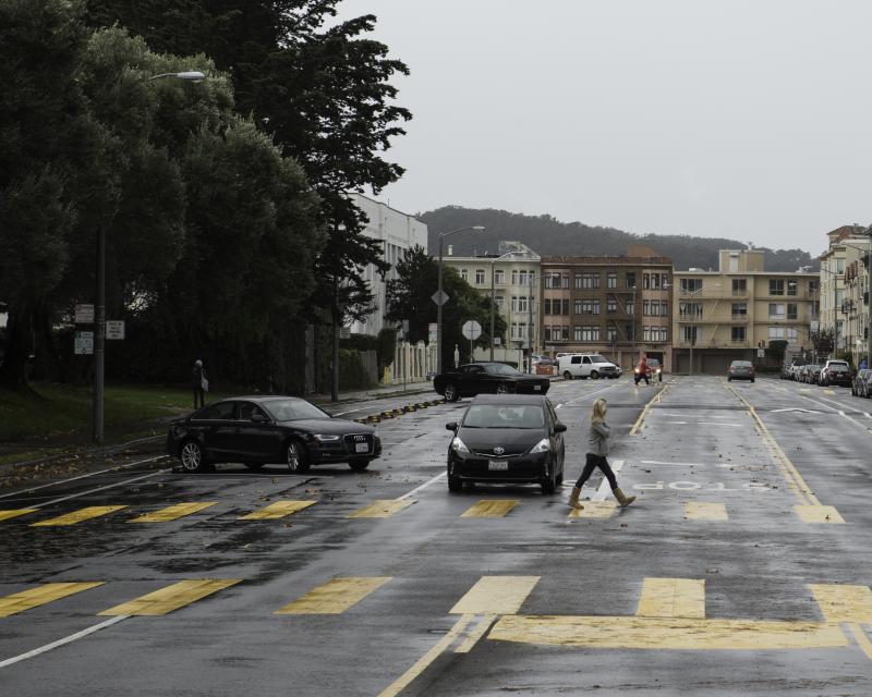 Woman crossing Bay Street in new high visibility school crosswalk