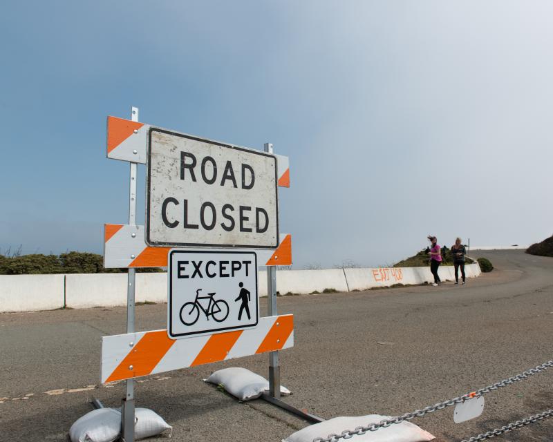 Two people walking in the car free portion of the Twin Peaks Figure 8 Pilot